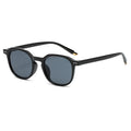 Gafas de sol redondas minimalistas negro/gris con detalle dorado en patilla | Cientosiete